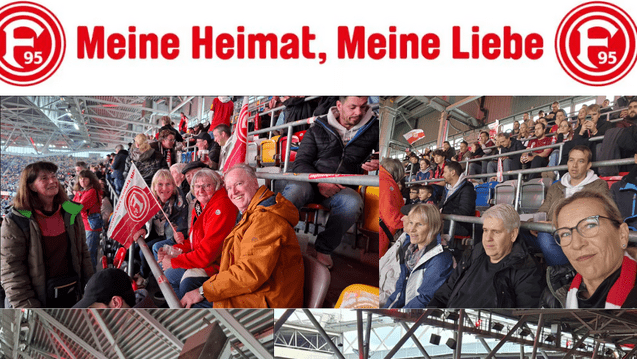 Zuschauer genießen ein Fußballspiel in einem Stadion, umgeben von Fans mit Fahnen und Teamfarben.