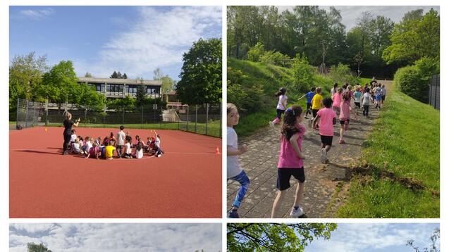 Gruppe von Kindern trainiert auf einem roten Sportplatz und joggt auf einem Weg durch eine grüne Landschaft.
