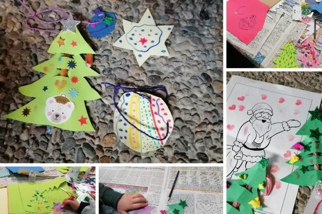 Bunte Weihnachtsbaumschmuck bastelt auf Zeitungspapier, inklusive Sterne, Kugeln und Tannenb&auml;ume aus Papier.